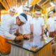 Bupati Badung Adi Arnawa menandatangani prasasti karya di Pura Dalem Desa Adat Ambengan, Abiansemal.