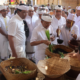 Gubernur Bali Wayan Koster menghadiri Upacara Pitra Yadnya Atma Wedana, Ngaben dan Nyekah Massal di Desa Adat Bualu, Kecamatan Kuta Selatan, Minggu (2/8).
