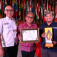 Kepala DPMD Kota Denpasar I Wayan Budha menerima penghargaan LPM Award mewakili Pemkot Denpasar di Gedung Merdeka, Kota Bandung.