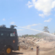 Personel Polresta Denpasar mengerahkan unit water cannon Sat Samapta untuk membantu pemadaman dan pendinginan pasca kebakaran di Jalan Nakula, Rabu, 2 September 2026.